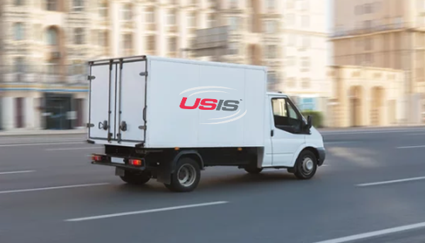 USIS truck on road