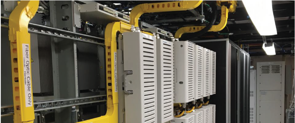 A rack of servers with yellow cables, providing efficient data storage and processing capabilities.

